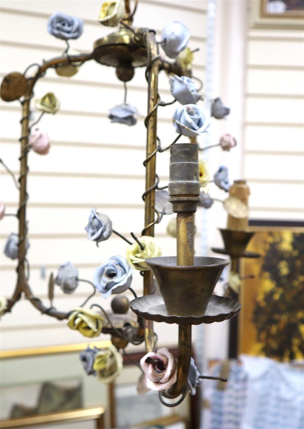 An Italian wrought iron and coloured glass hanging lantern and a brass chandelier, mounted with porcelain, lantern approximately 60cm l